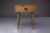 Handcrafted Mid-Century oak nightstand with a sleek design.